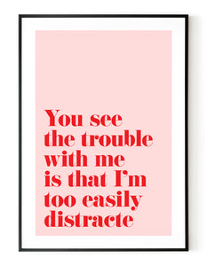 A portrait ‘you see the trouble with me is that I’m too easily distracted’, typographic giclée print on white paper in a black frame, using pink and red ink.