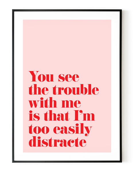 A portrait ‘you see the trouble with me is that I’m too easily distracted’, typographic giclée print on white paper in a black frame, using pink and red ink.