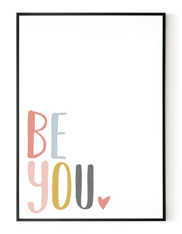 A portrait giclée print with ‘be you’ message, on white paper in a black frame, using peachy pastel shades.