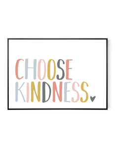 A landscape giclée print with ‘Choose Kindness’ message, on white paper in a black frame, using peachy pastel shades.