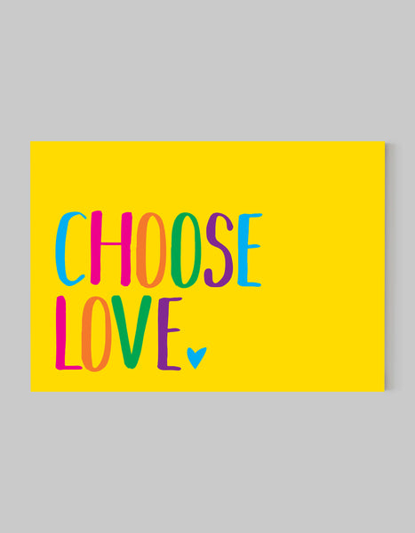 A landscape giclée print with ‘Choose Love’ message, on white paper, using bold bright colours on a yellow background.