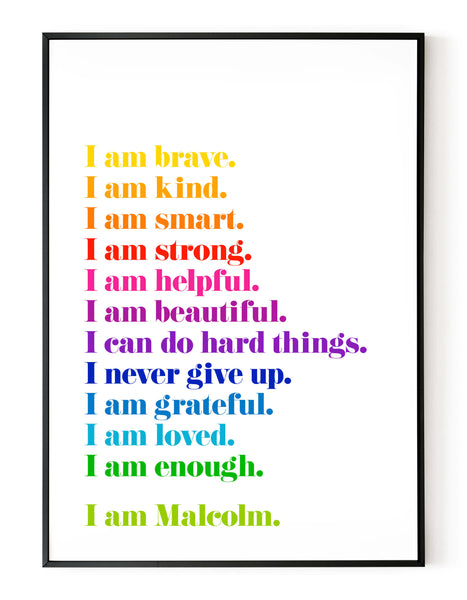 A portrait personalised ‘affirmations’ giclée print, on white paper in a black frame, using bright rainbow coloured inks.