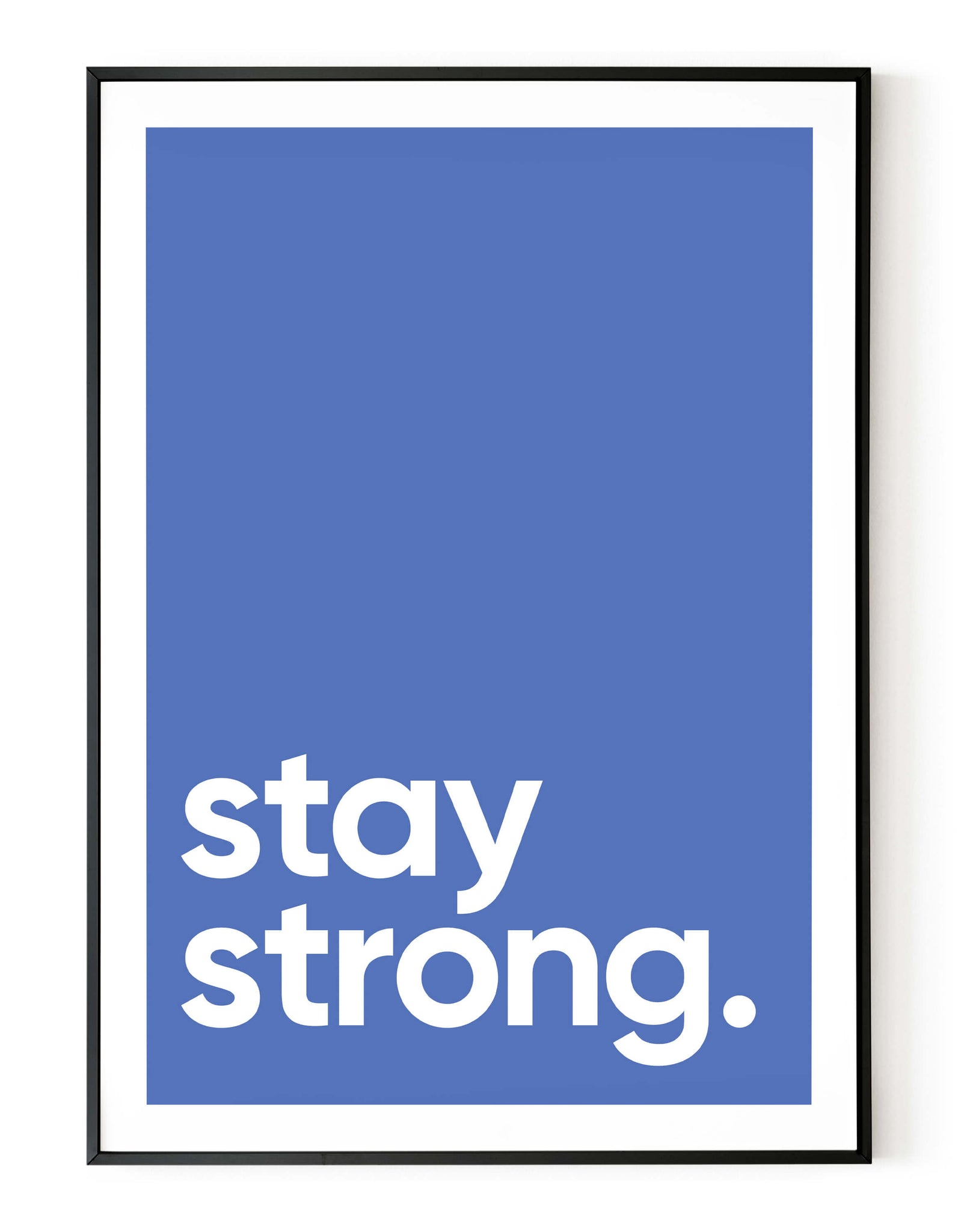A portrait ‘stay strong’ giclée print, on white paper in a black frame, using a lavender shade.
