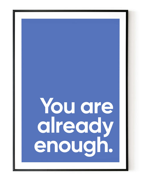 A portrait ‘you are already enough’ giclée print, on white paper in a black frame, using a lavender shade.