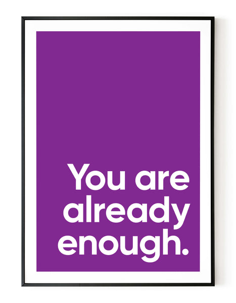 A portrait ‘you are already enough’ giclée print, on white paper in a black frame, using a purple ink.