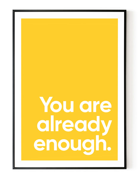 A portrait ‘you are already enough’ giclée print, on white paper in a black frame, using a yellow ink.