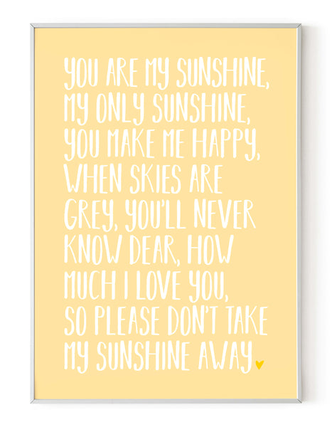 A portrait ‘you are my sunshine’ lyrics giclée print, on white paper in a white frame, using pastel yellow ink.