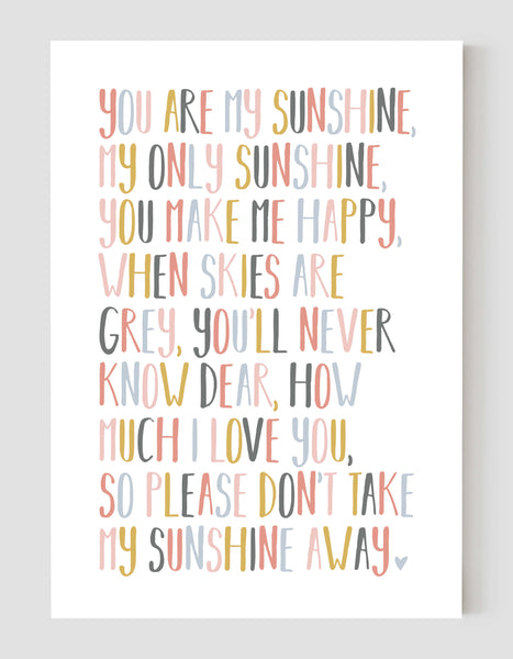A portrait ‘you are my sunshine’ lyrics giclée print, on white paper, using peachy pastel shades.
