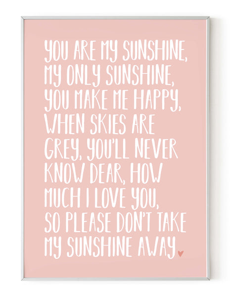 A portrait ‘you are my sunshine’ lyrics giclée print, on white paper in a white frame, using pastel pink ink.