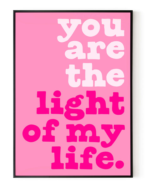 A portrait ‘you are the light of my life’ giclée print, on white paper in a black frame, using magenta ink.