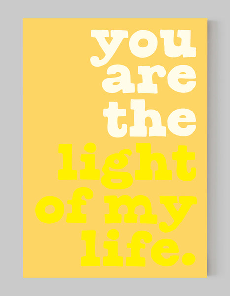 A portrait ‘you are the light of my life’ giclée print, on white paper, using yellow ink.